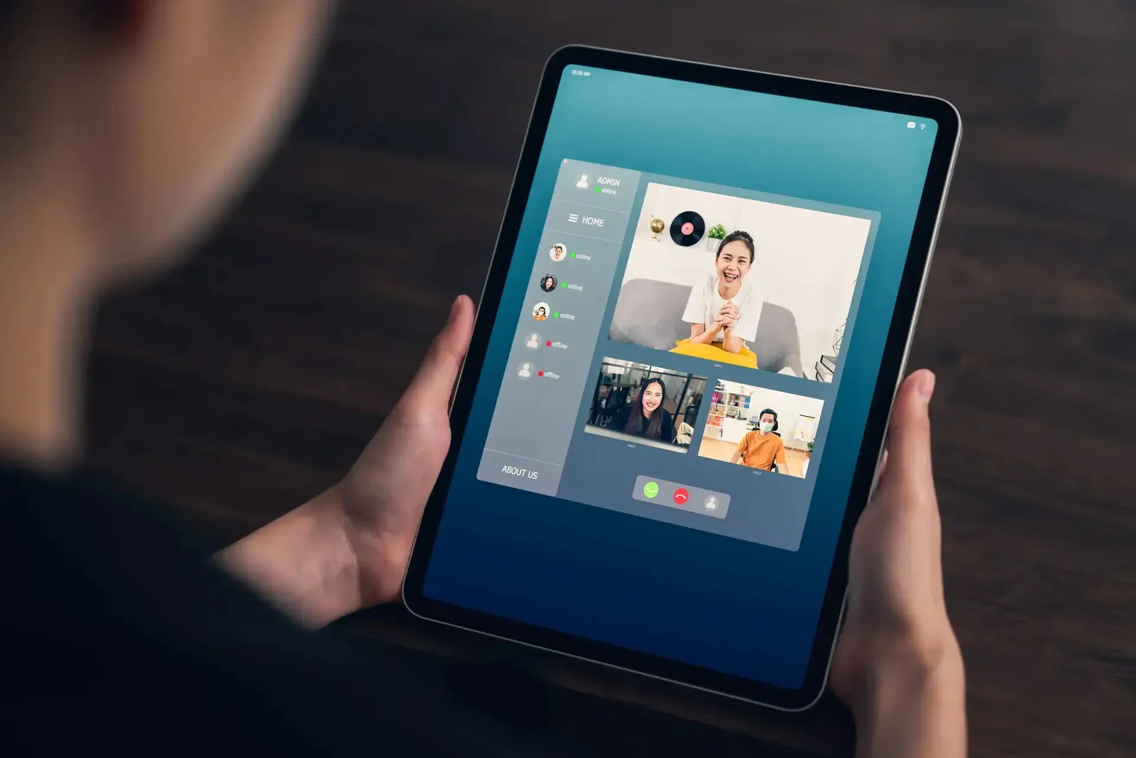 Tablet screen showing a live telehealth video visit with an interpreter